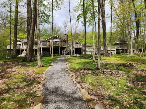 View from lake to back of house with expansive deck. Path to lake.