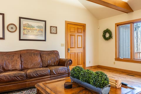 Great room with soaring ceilings and wood beams.