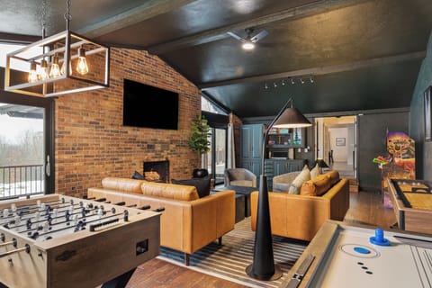 BK Stays offers a stylish game room w/ arcade games, shuffleboard, and smart TV.