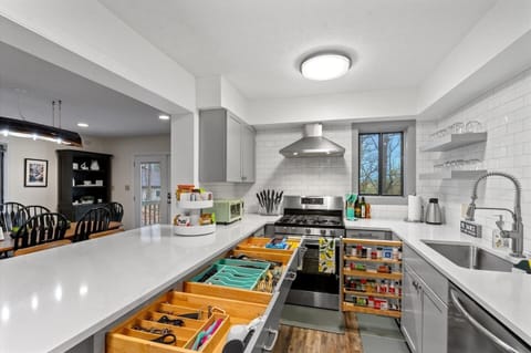 Fully stocked kitchen equipped with everything you need to prepare a meal.