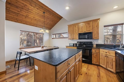 Kitchen & dining area next to living room space