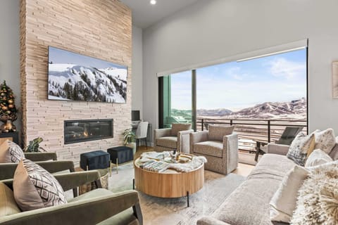 Cozy up with the gas fireplace, Oversized TV and WOW- what a view! 