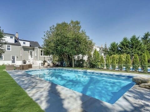 Relax in the private backyard featuring a pool
