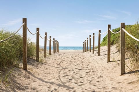 Stroll barefoot down the sandy path straight to the sea.