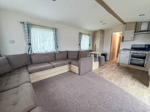 The living room serves as the true heart of your holiday home, a welcoming space designed for connection and relaxation.