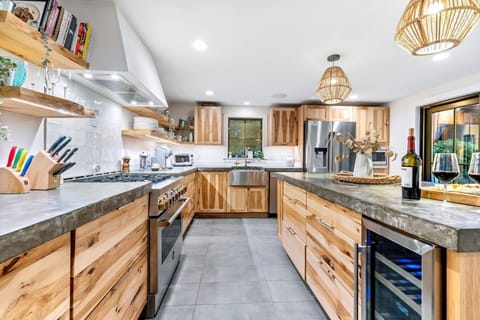 A fully stocked kitchen with an island set for four for your convenience.