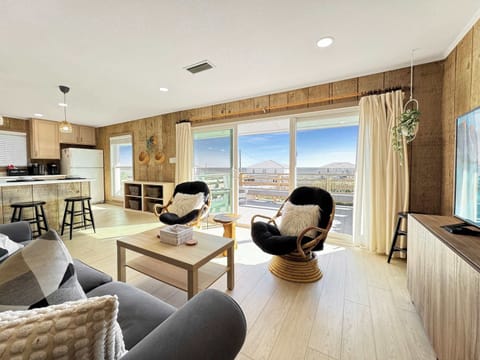 Bright living area with sofa sleeper, and Smart TV