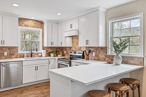  New breakfast bar seats four.