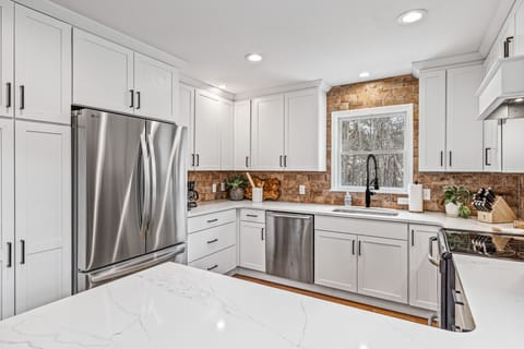 New refrigerator has ice maker in freezer drawer and inside water dispenser.