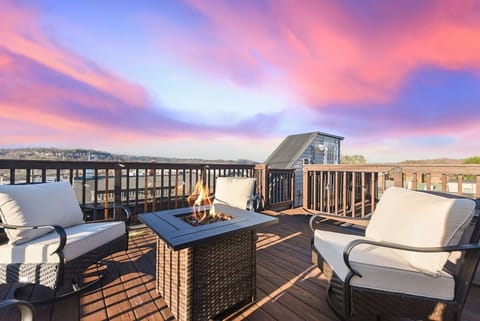 Relax by the fire pit on the rooftop deck and take in stunning sunset views.