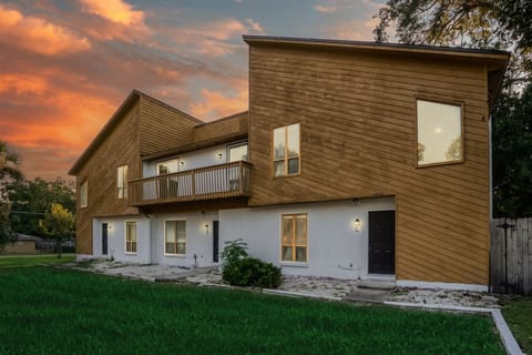 Charming exterior with modern design, captured at sunset.