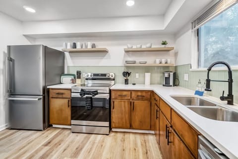 Fully equipped kitchen with modern appliances and sleek design.