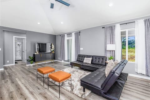 Stylish living area with modern seating and natural light.