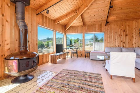 Bright living area with fireplace, Smart TV, and sectional sofa
