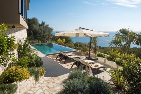 Patio with infinity heated pool, private garden, sun loungers and sea view in Luxury Rental Villa Energy Orebic - Peljesac 