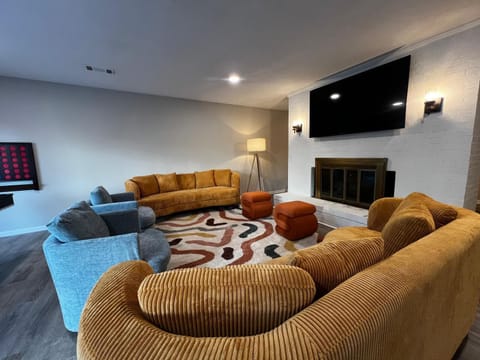 Spacious living area with a TV, great for relaxation and entertainment!