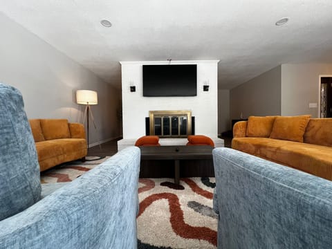 Spacious living area with a TV, great for relaxation and entertainment!
