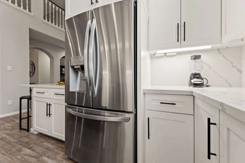 Kitchen with full-sized fridge