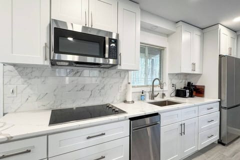 Electric cooktop with over-the-range microwave