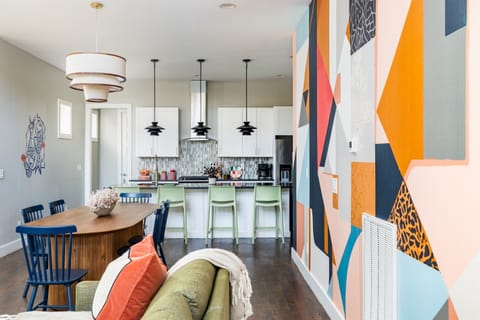 Dining area features dining table + island seating.