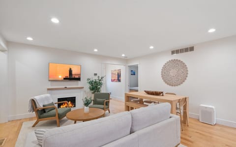 Walk through the front door to this elegant space with a cozy fireplace and shared sitting and dining space.