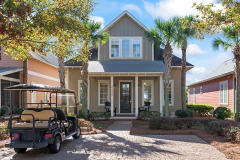 Front of home with golf cart