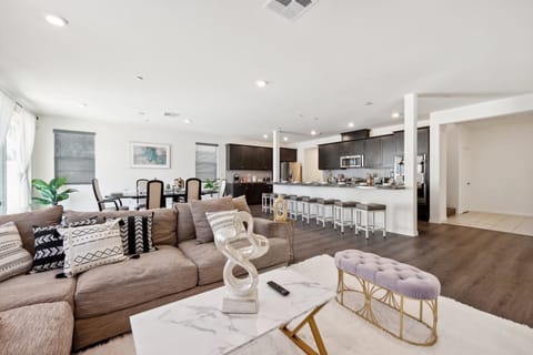 Spacious living room conveniently located near the dining area and kitchen.
