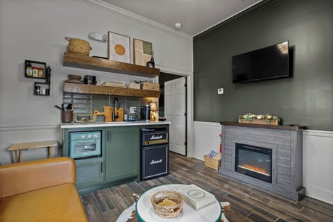 Our custom tiny kitchen stocked with airfryer/toaster oven,plug in stovetop,fridge,Keurig & blender