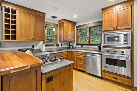 Kitchen with gas range, dishwasher, drip-style coffee maker, and Keurig coffee maker