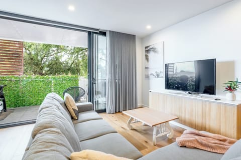 Bright and comfy living room with a TV, perfect for movie nights too!