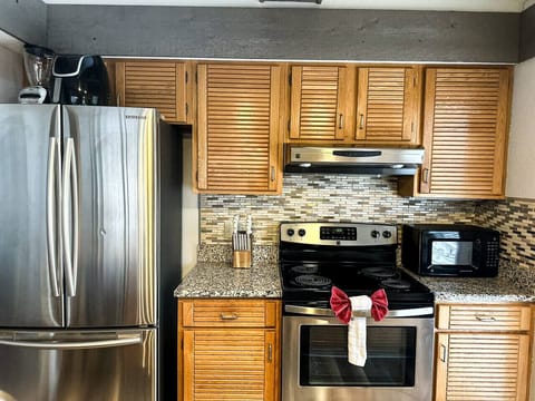 Every meal is a breeze with this fully stocked kitchen featuring modern appliances and plenty of prep space.