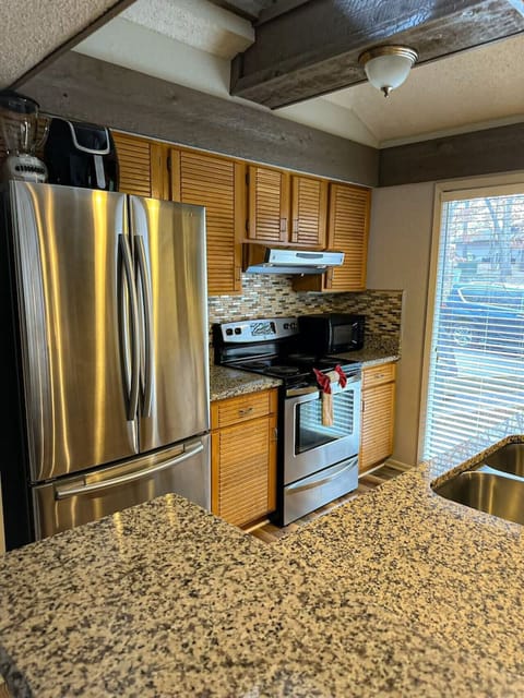 Cook like a pro in this fully equipped kitchen, featuring sleek stainless steel appliances and granite countertops!