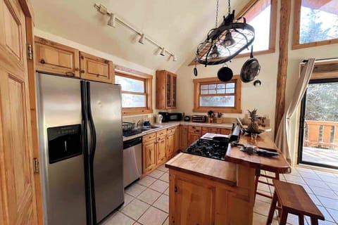 Very bright kitchen with mountain views and full amenities.