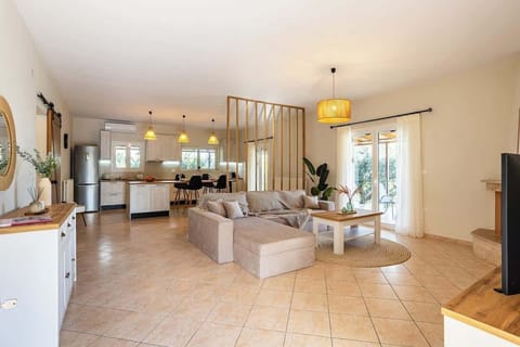 Spacious Living Room – Open layout with soft lighting and stylish décor, ideal for relaxation.