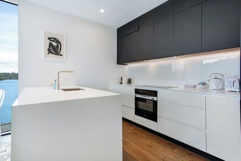 The kitchen has a cooktop, oven, microwave, toaster, kettle and dishwasher.