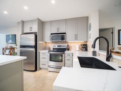 Electric range, dishwasher and fridge for all your cooking needs.