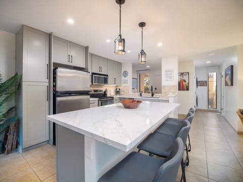 Open concept kitchen for entertaining.  Main island with 4 stools, and lots of storage.
