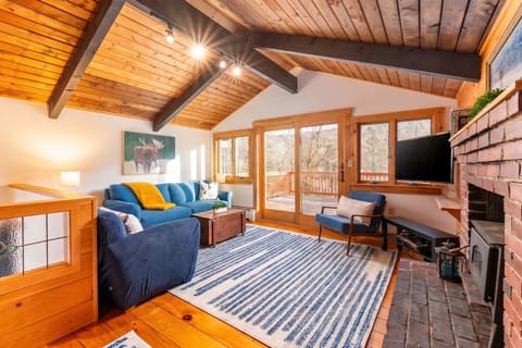 A bright and cozy living room with vibrant color, perfectly positioned to enjoy the views.