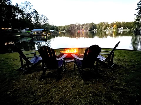 Relax at the end of the day around a fire by the lake.
