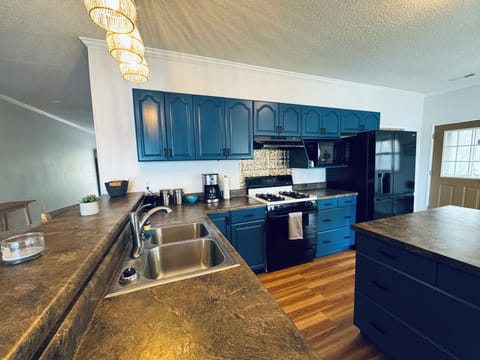 Complete with pots, pans, dishes, silverware and basic spices