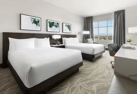 Spread out in a roomy double-queen retreat with sunlight.