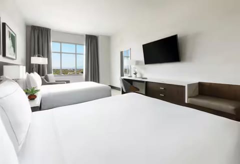 Relax with two queen beds and an easy lounge corner.