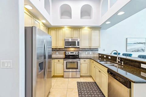 Fully equipped kitchen with modern appliances and ample counter space.