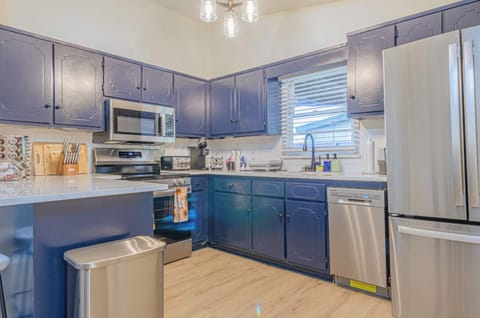 Cook in style in our charming kitchen with its striking blue cabinetry. A perfect blend of form and function. #kitchendesign #bluekitchen #vacationhome #homedecor

