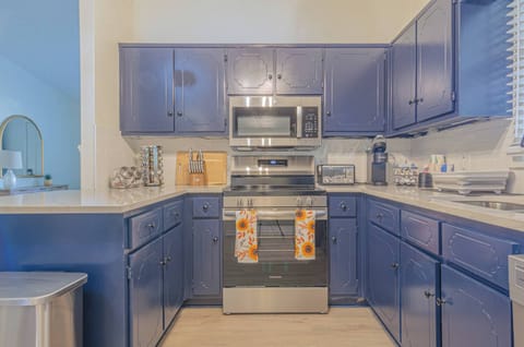 Whip up delicious meals in our fully equipped kitchen, complete with modern appliances and everything you need to feel right at home. #fullyequippedkitchen #vacationrental #cooking #kitchengoals