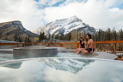 Relax in the hot tub as snow-capped peaks frame the view.
