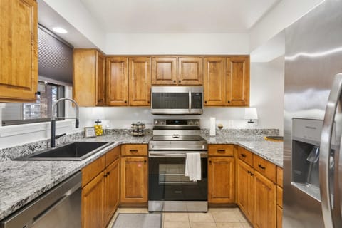 The welcoming kitchen offers ample space & every home comfort
