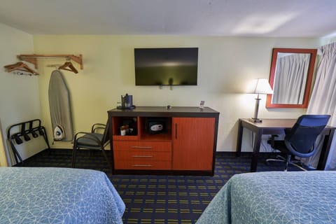 Settle in with a large TV, dresser, and easy seating.