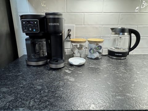 Indulge in our stocked coffee station, complete with hot water kettle. 