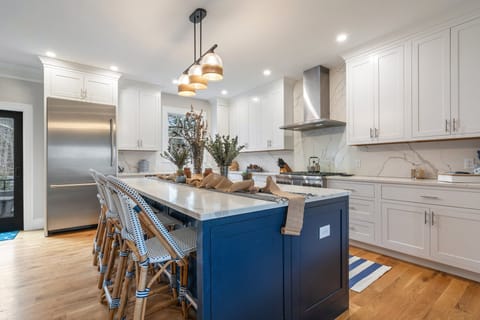 Spacious chef’s kitchen with high-end appliances and ample counter space.